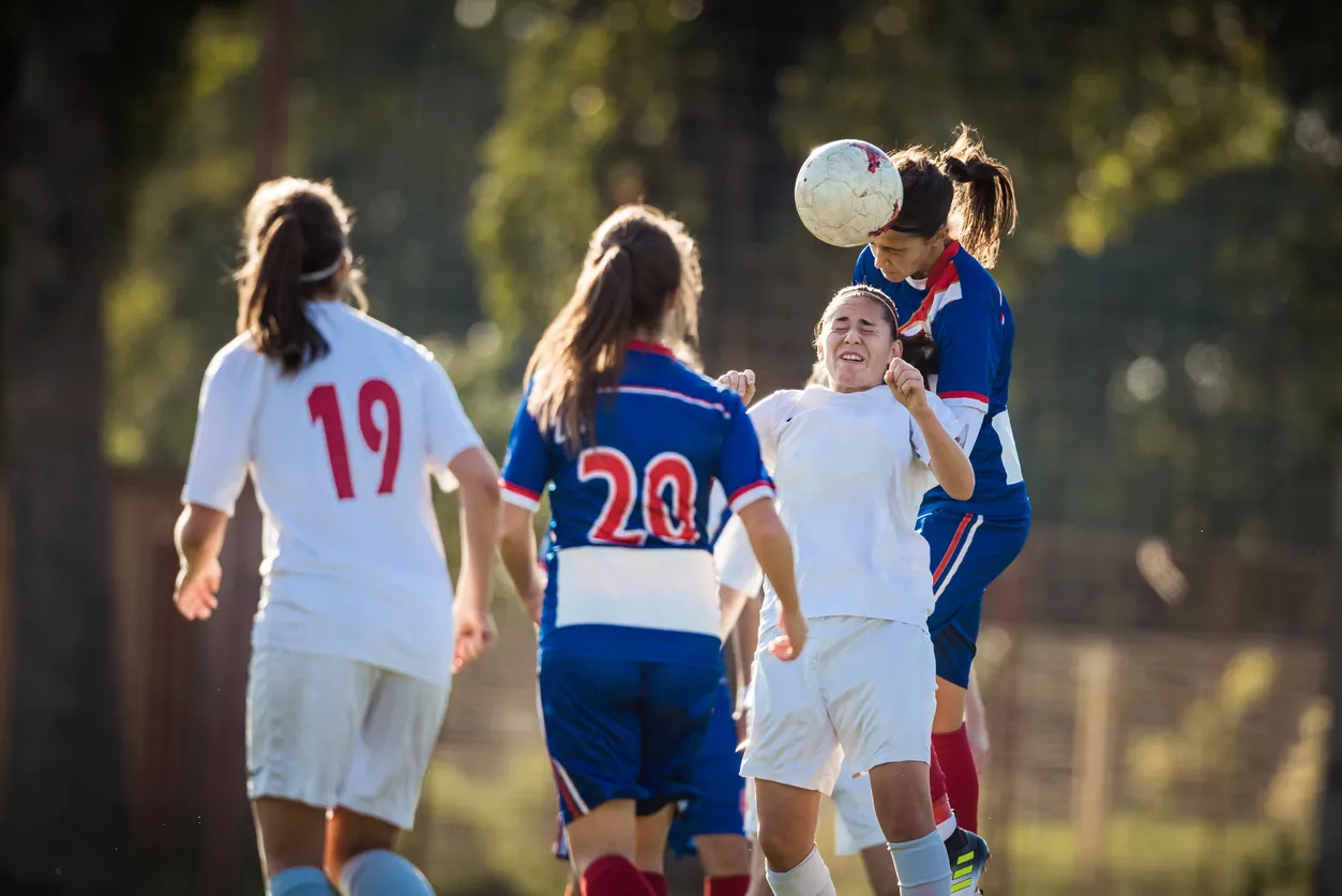 girl with sports injury headache